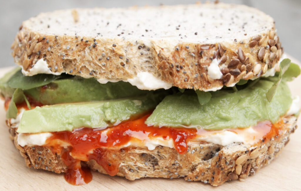 Hummous, avocado and chilli jam sandwich